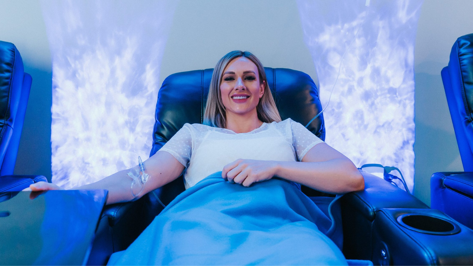 Patient receiving IV infusion therapy with premium nutrients in a clinical wellness setting