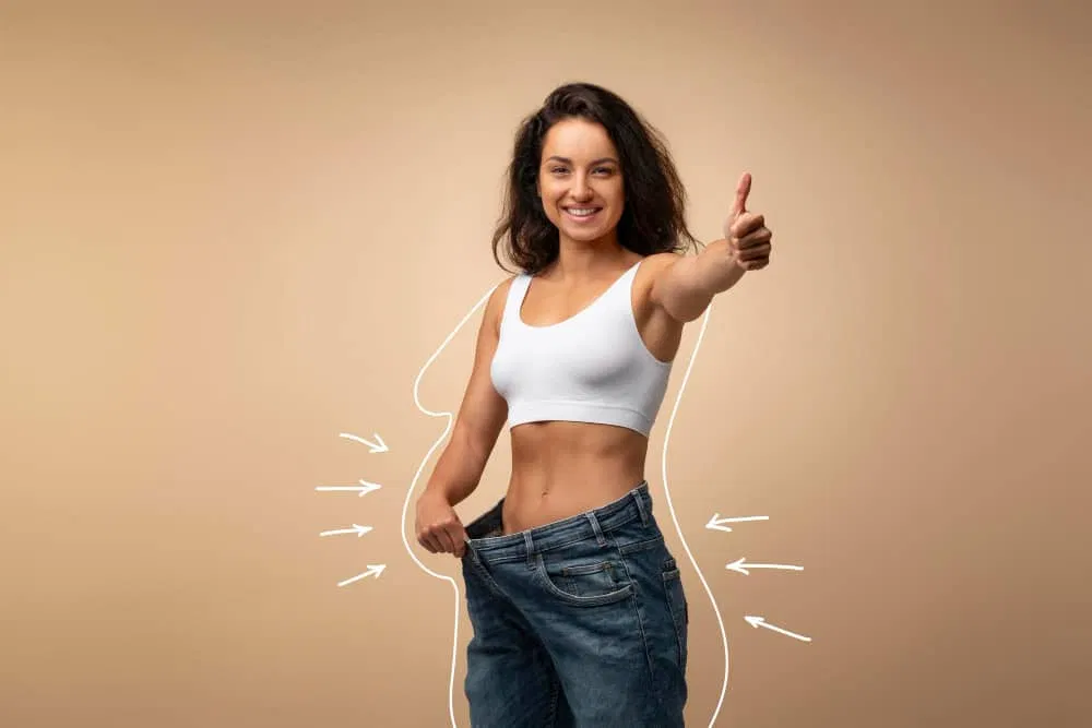 Healthcare professional measuring patient waist during medical weight loss consultation